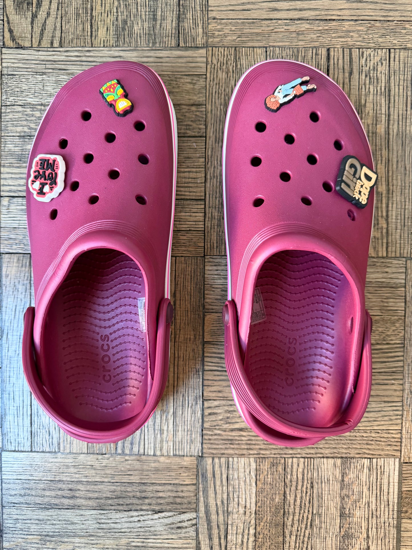 MAROON CROCS CLASSIC CLOGS WITH WHITE TRIM AND JIBBITZ