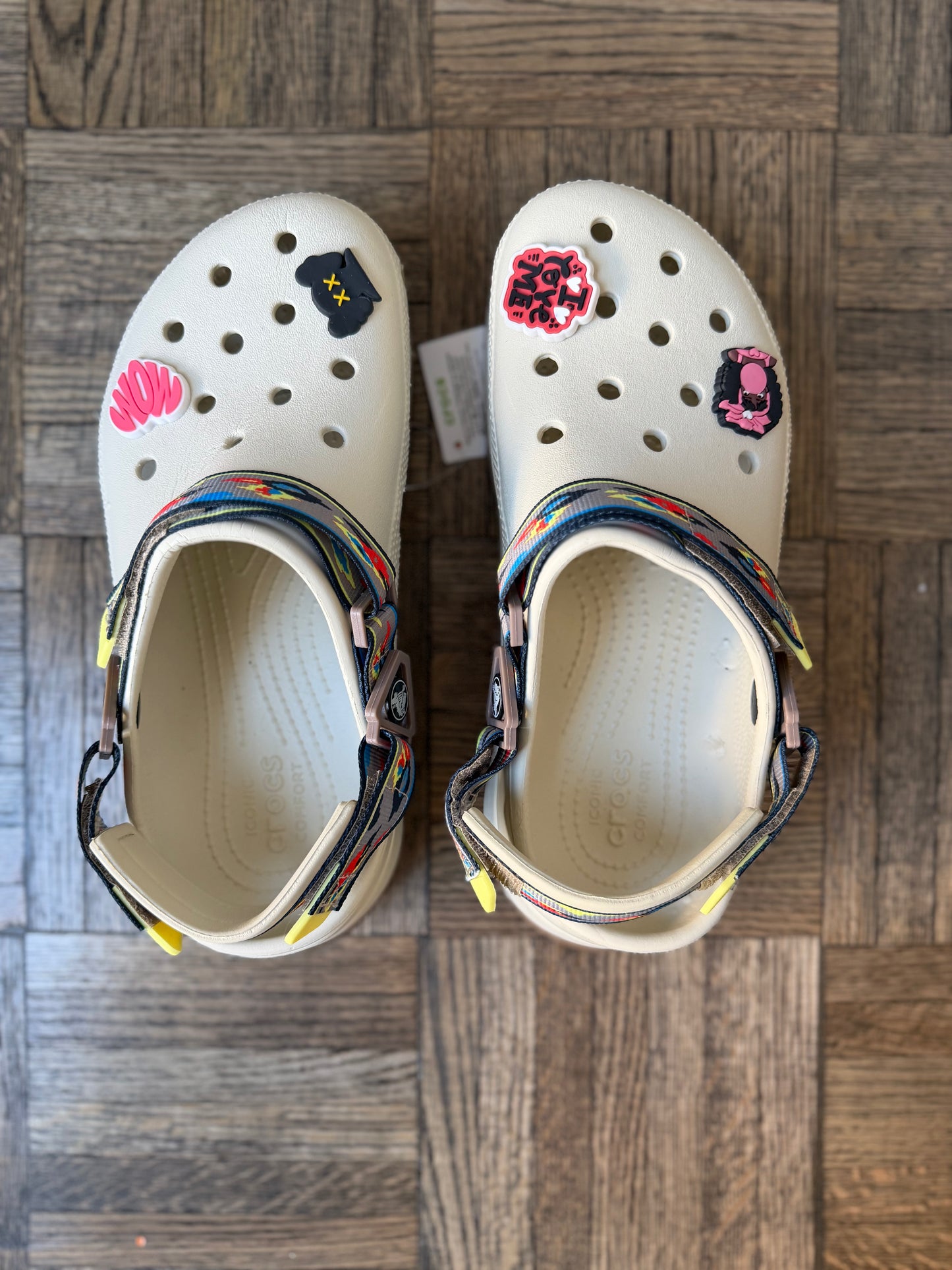 CREAM CROCS WITH COLORFUL TRIBAL PRINT STRAP & “WOW” JIBBITZ